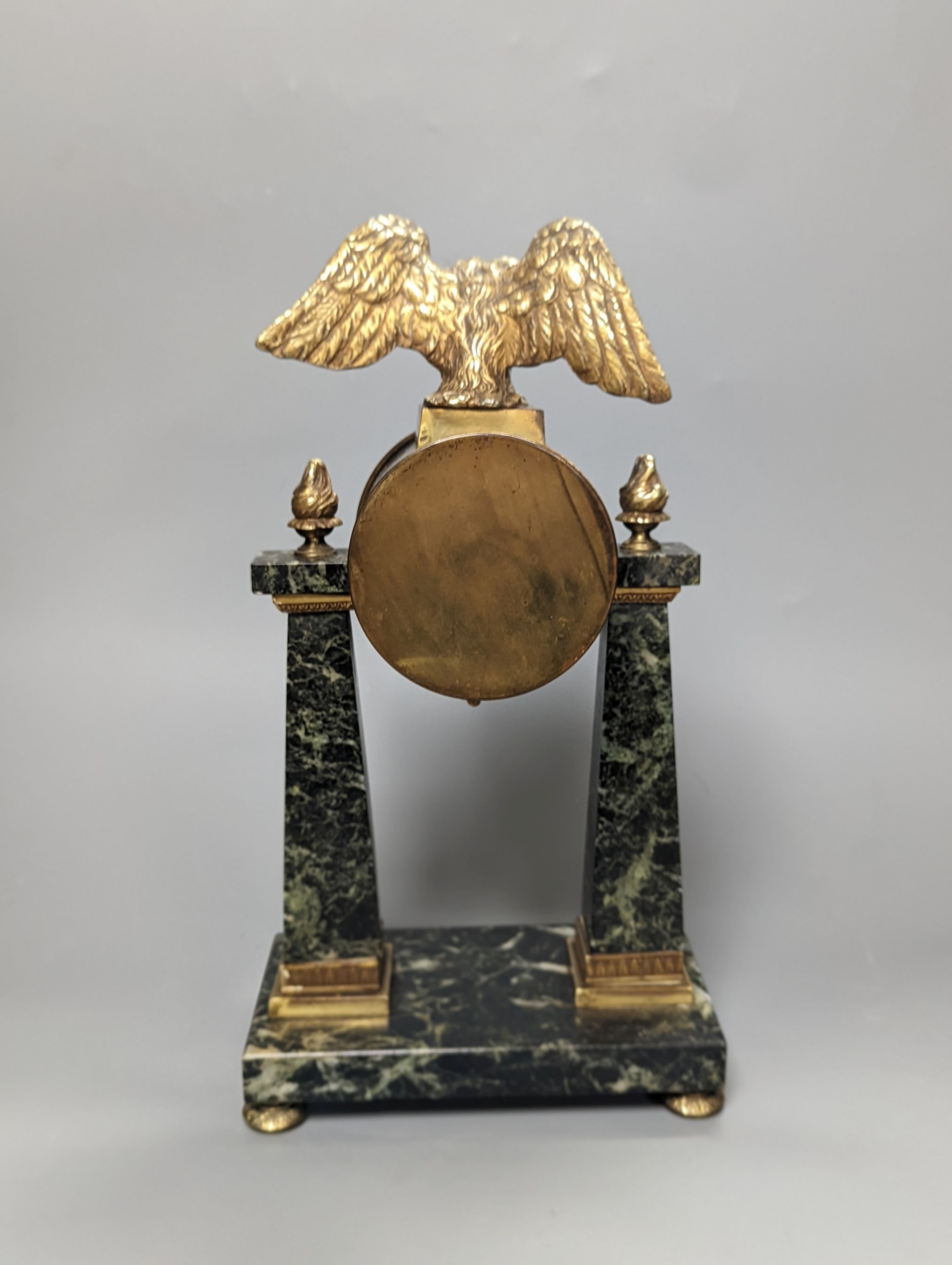 A French Empire style marble and ormolu portico timepiece 32cm